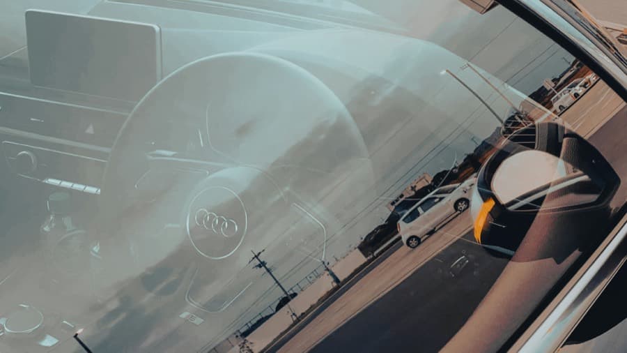 A technician restoring a windshield